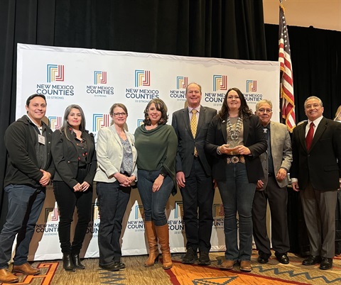 Staff receiving the Triple Crown Award NM Counties event