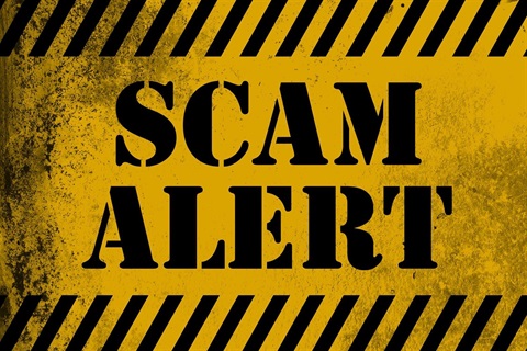 Yellow striped Scam Alert Sign