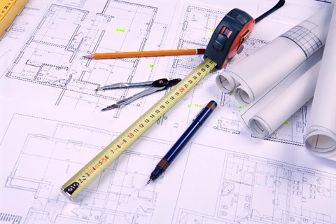 Blue prints, measuring tape, compass and pencils