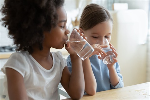 kids drinking water from glasses