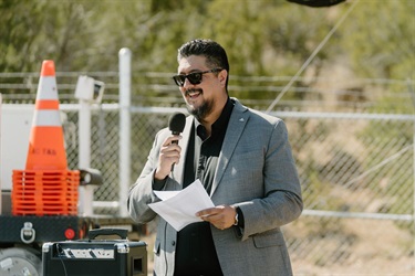 A man talking into a microphone