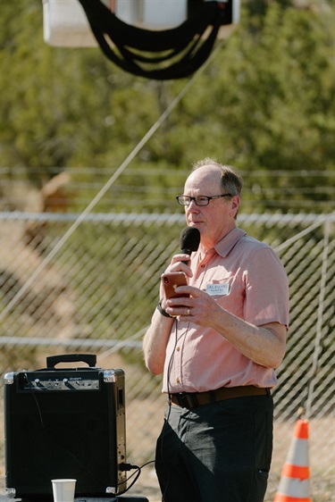 A man talking into a microphone