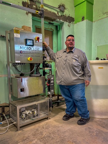 Water Systems Supervisor Victor Tanuz explains the injection site in a Water Booster Station.