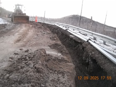 sections of conduit pipe next to trench