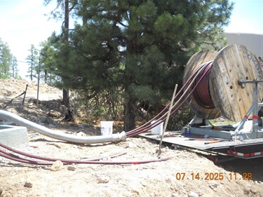 spool of wires pulled through conduit 